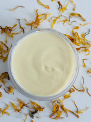 Botika Shea Butter & Calendula Body Balm with open jar — rich botanical balm for deep skin nourishment and moisture
