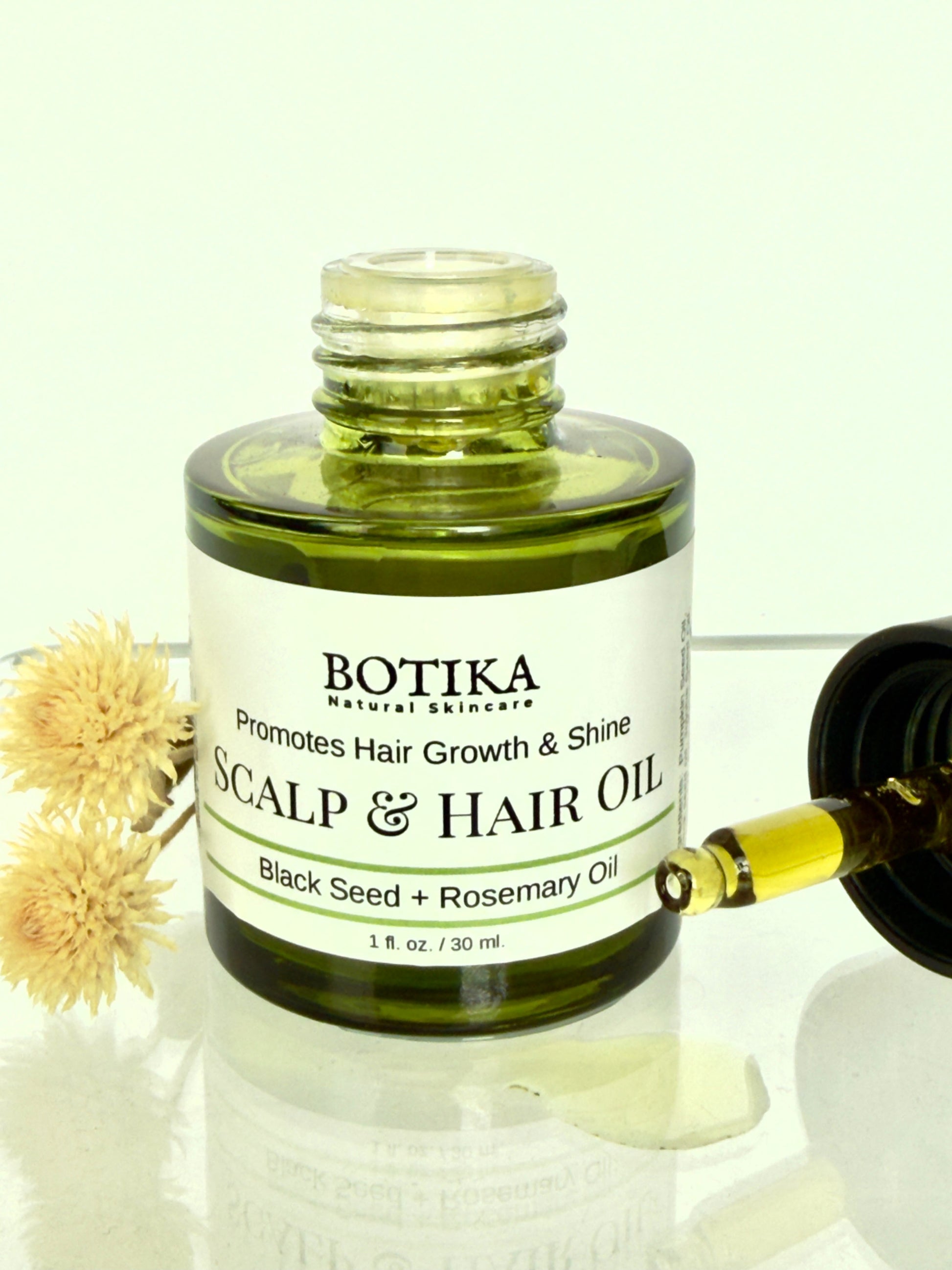 Botika Scalp & Hair Growth Oil with Black Seed & Ashwagandha with open cap — nourishing botanical scalp treatment for all hair types