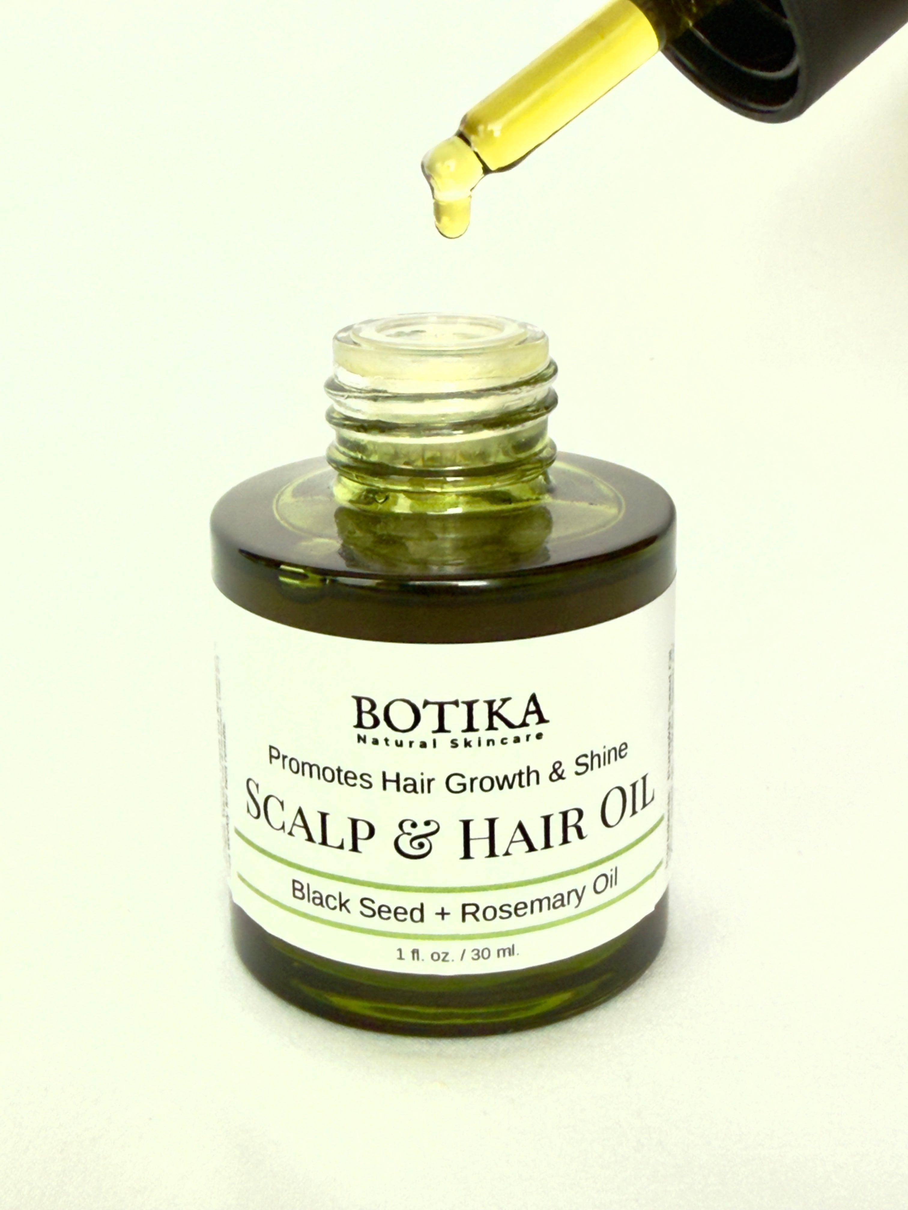 Botika Scalp & Hair Oil bottle with dropper — botanical 10-oil blend for scalp health and hair growth
